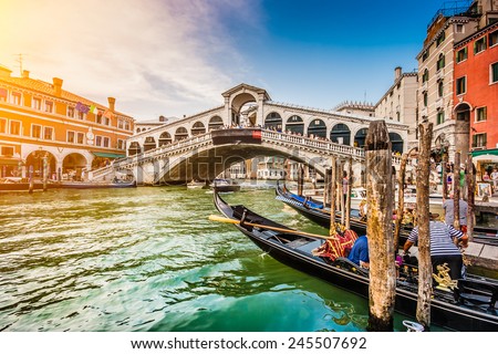 Panoramic view of famous Canal Grande from famous Rialto Bridge at sunset in Venice, Italy with retro vintage Instagram style filter effect Royalty-Free Stock Photo #245507692