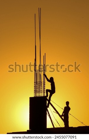 Constructon worker working during sunset.
World labor Day
