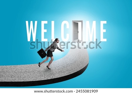 Businesswoman on the road leading to welcome sign