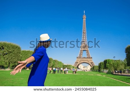 Young woman background Eiffel Tower in Paris
