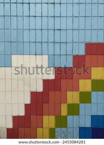 Wall with multi-colored bricks as background, texture and pattern.painted brick wall, abstract background of different colors.