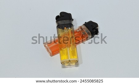 
2 red and yellow lighters filled with different gases can still be used for burning.