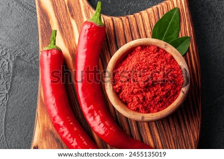 This captivating photo showcases a vibrant array of culinary essentials, including chili powder, dried chili, chili flakes, spices, seasoning, and culinary herbs. From the aromatic spice blend to the 