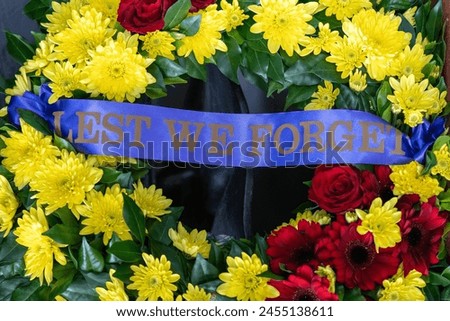 Floral flower wreaths, Anzac day, remembrance of fallen soldiers service men and women, wars and conflicts, Australia Royalty-Free Stock Photo #2455138611