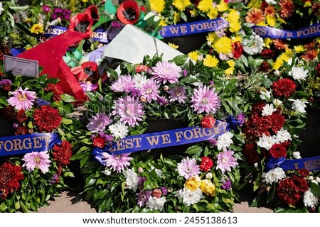 Floral flower wreaths, Anzac day, remembrance of fallen soldiers service men and women, wars and conflicts, Australia Royalty-Free Stock Photo #2455138613