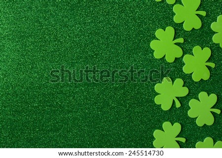 Green Clovers or Shamrocks  on Green Background Background for St. Patrick's Day Holiday