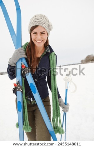 Woman, ski and snow with smile in portrait for vacation, excited and ready on outdoor adventure for fitness. Person, happy and equipment for winter sports in nature at holiday resort in Switzerland