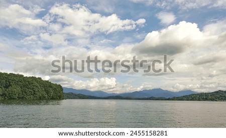 view of the "Riam Kanan" reservoir with a clear, cloudy sky, between the Meratus mountains Royalty-Free Stock Photo #2455158281