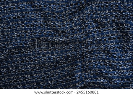 Texture of fabric blue colour with black and white colours thread, top view, textured background.