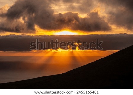 Sunset over the atlantic ocean on Flores, Azores islands, Portugal.