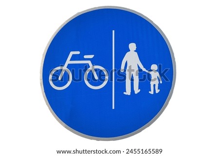 a road sign indicating a bike path and sidewalk. Silhouettes of people and a bicycle on a blue background with a white border