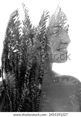 A double exposure portrait of a woman merged with a foliage photo