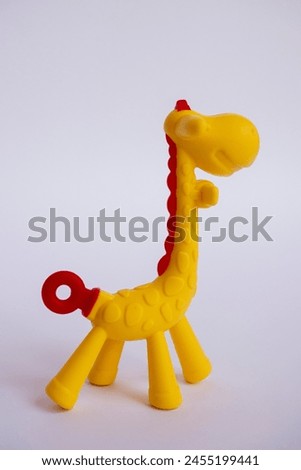 Rubber giraffe toy for baby. Giraffe shaped baby gum reflexology tool. Side view Rubber giraffe.