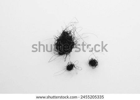 Hair loss coils with white isolated object.