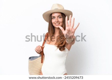 Young caucasian woman in swimsuit in summer holidays isolated on white background counting five with fingers