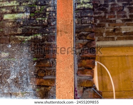 Photos and pictures of dirty window glass and views of brick walls