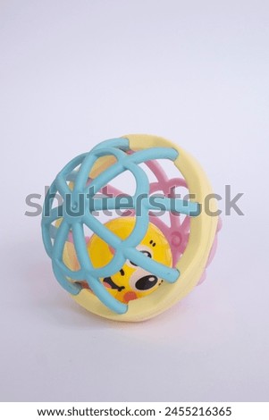 Colorful baby rattle with white isolated background. Baby Toys for Playtime - Large Play Ball, Teething Ball, Grasping perfect ball.