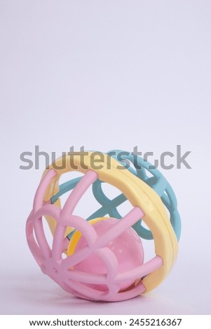 Colorful baby rattle with white isolated background. Baby Toys for Playtime - Large Play Ball, Teething Ball, Grasping perfect ball.