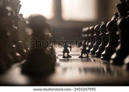 Medieval battle scene with cavalry and infantry on chessboard. Chess board game concept of business ideas and competition and strategy ideas Chess figures on a dark background with smoke and fog. Royalty-Free Stock Photo #2455247995