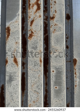 Rusty metal fence photo. Metal corrosion chemical process