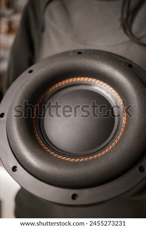 An automotive tire speaker is installed in a motor vehicles door, using audio equipment to enhance sound quality. This artful integration blends seamlessly with the automotive wheel system