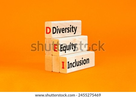 DEI diversity equity and inclusion symbol. Concept words DEI diversity equity inclusion on blocks. Beautiful white background. Business DEI diversity equity and inclusion concept. Copy space.