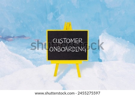 Customer onboarding symbol. Concept words Customer onboarding on beautiful yellow black blackboard. Beautiful blue ice background. Business Customer onboarding concept. Copy space.