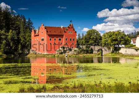 The Cervena (Red) Lhota Chateau is a beautiful and unique example of Renaissance architecture. It is located in the South Bohemian Region of the Czech Republic, surrounded by a picturesque lake. Royalty-Free Stock Photo #2455279713
