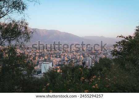 Santiago de Chile skyline from San Cristobal hill. Andes mountain range on the background