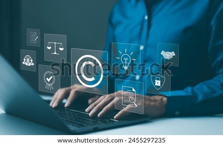Copyright or patent concept. Professional working on a laptop with digital icons representing intellectual property and digital copyright law. Trademark license, copyleft, Rights symbol, Piracy crime,