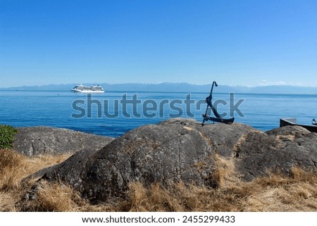Perfect view with an anchor in the foreground and a boat in the background
