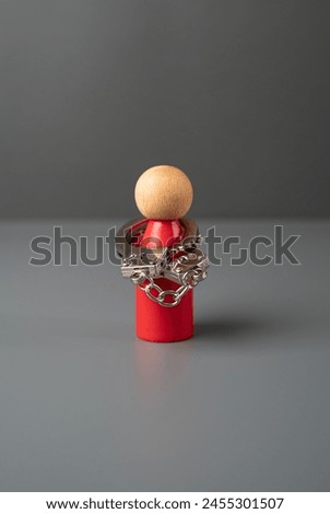Man figurine in handcuffs. Mental health. Limitations and psychological problems. Stiffness and tightness. Find self-confidence. Throw off the shackles, liberate yourself. Remove fears and prejudices Royalty-Free Stock Photo #2455301507