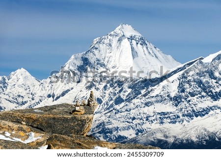 Mount Dhaulagiri with stone pyramids, view from Thorung la pass from Annapurna himal to Dhaulagiri himal, Nepal Himalayas mountains Royalty-Free Stock Photo #2455309709