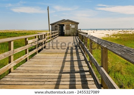 Dauphin Island Pier is pictured, May 15, 2016, in Dauphin Island, Alabama. The 850-foot public pier once extended into the water but erosion and shifting sand have​ left the pier on land.