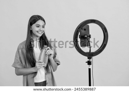 happy teen girl beauty blogger in studio. teen girl beauty blogger on background.