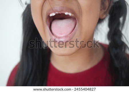 close up of child screaming at home 