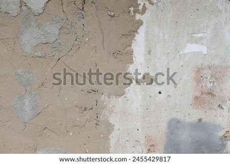An old wall, shabby, with stains all over the screen.