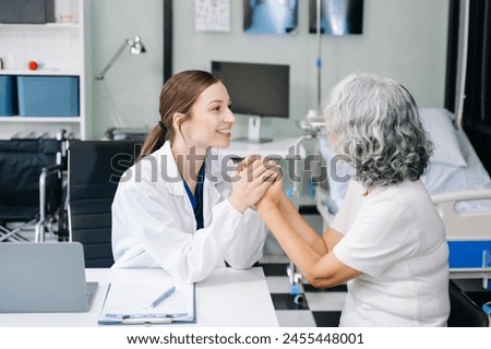 Portrait of female doctor explaining diagnosis to her patient. Doctor Meeting With Patient In Exam Room. A medical practitioner reassuring a patient in hospital
