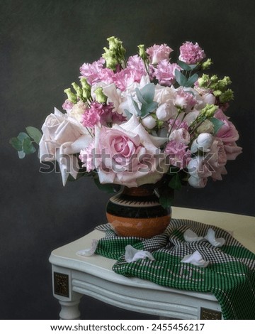 Still life with bouquet of pink delicate flowers