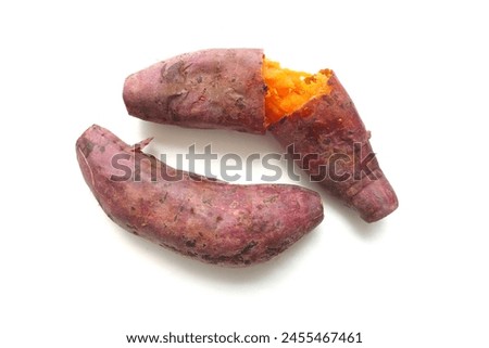 Hot Baked Organic Japanese Sweet Potatoes by air frier oven, diet and healthy food, isolated on white background. Boiled or grilled yellow sweet potato Royalty-Free Stock Photo #2455467461