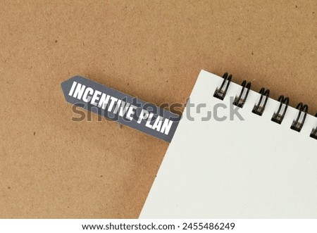 books and paper tags with the word incentive plan. next action plan concept Royalty-Free Stock Photo #2455486249