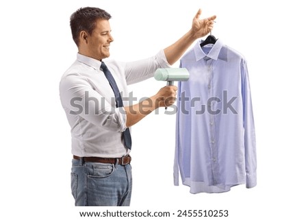 Man using a hand steam iron for a shirt isolated on white background