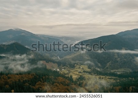 Aerial view of beautiful mountains on cloudy day