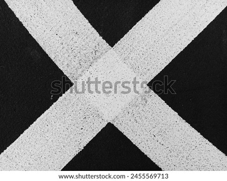 Lines, abstract sports background or texture on outdoor sports field. Black and white lines on the sports field (black and white shooting)