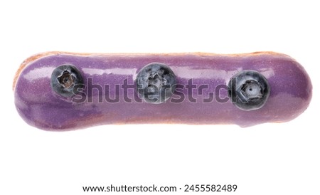 Delicious eclair decorated with blueberries isolated on white