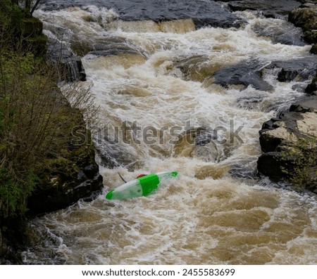 Canoeists going down the wier at Llangollen Royalty-Free Stock Photo #2455583699