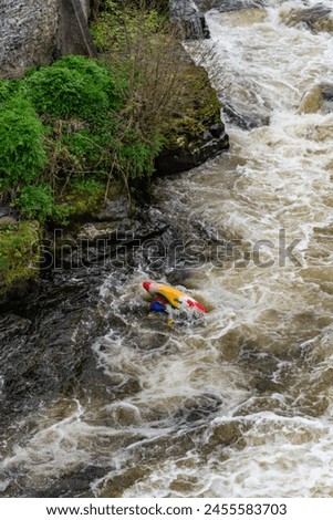 Canoeists going down the wier at Llangollen Royalty-Free Stock Photo #2455583703