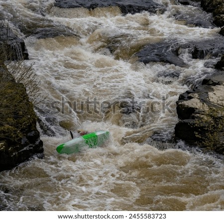 Canoeists going down the wier at Llangollen Royalty-Free Stock Photo #2455583723