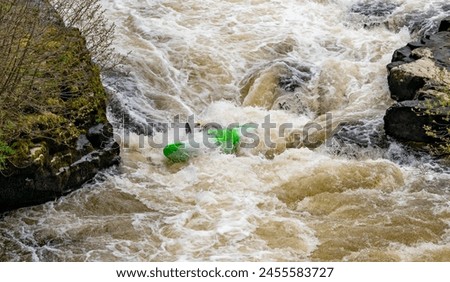 Canoeists going down the wier at Llangollen Royalty-Free Stock Photo #2455583727