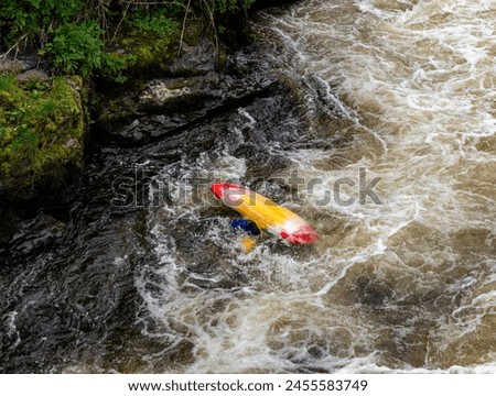 Canoeists going down the wier at Llangollen Royalty-Free Stock Photo #2455583749